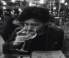 Alvaro Morte consuming alcohol